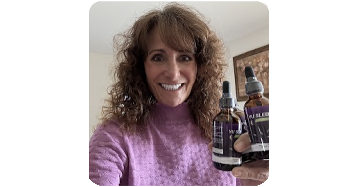 Happy Yu Sleep customer holding two bottles of the supplement
